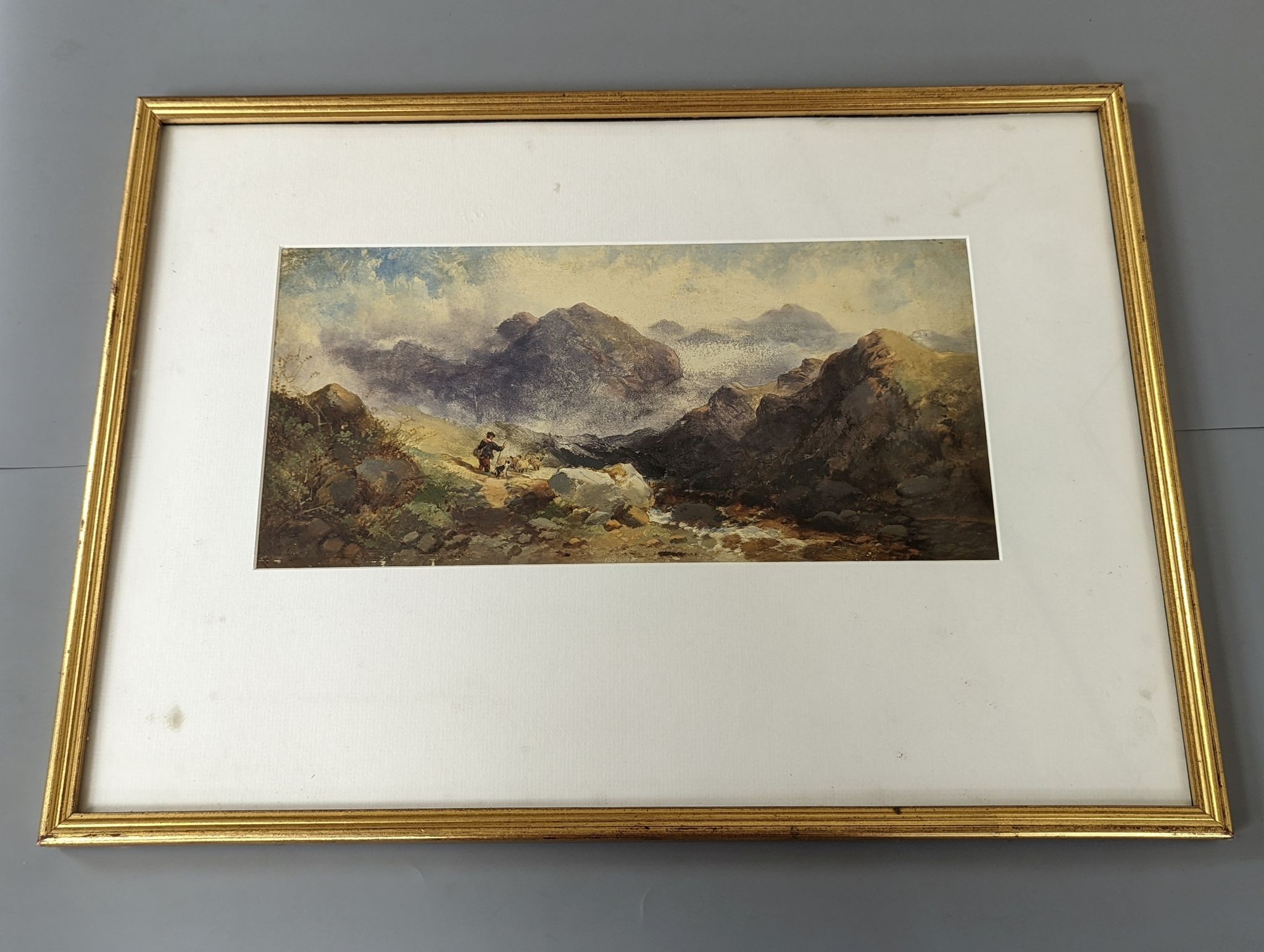 19th century Scottish School, oil on card, Shepherd and flock in the Highlands, indistinctly signed and dated '60, 16 x 34cm